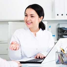 Patient discussing payment options with dental team member