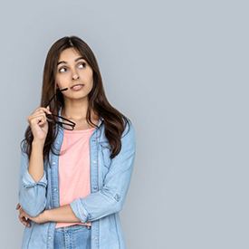 Woman with curious, thoughtful expression on her face 