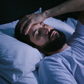 Tired man, may need to get tested for sleep apnea