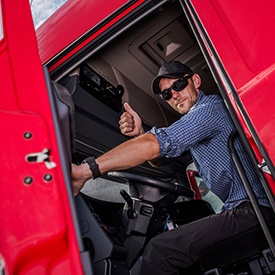 Truck driver giving thumbs up for sleep apnea treatment