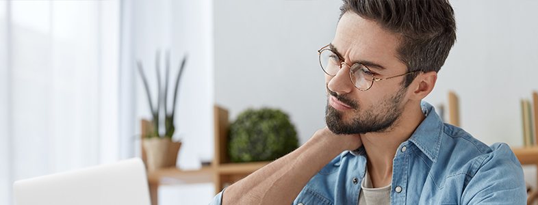 Man holding neck in pain