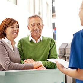 Man and woman at reception desk