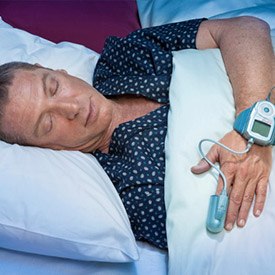 Man with sleep monitor