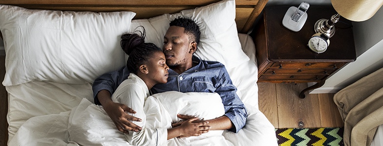 Man and woman sleeping peacefully together