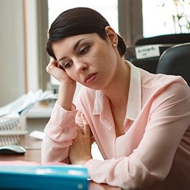 Tired woman at work