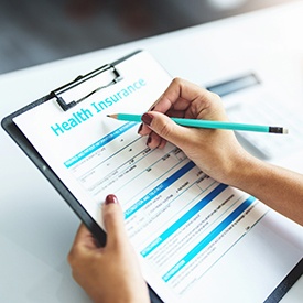 Health insurance document on clipboard