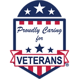 Patriotic badge that says Proudly Caring for Veterans