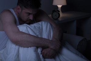 Man waking up from sleep apnea nightmare in Fort Worth