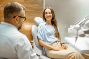 Dentist discussing signs of sleep apnea with patient