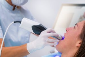 Using digital scanner to capture images of patient’s teeth