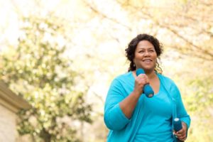 Woman exercising outside to reduce sleep apnea symptoms